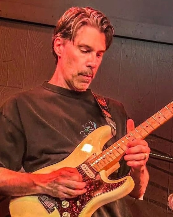 Bill Bressette playing electric guitar